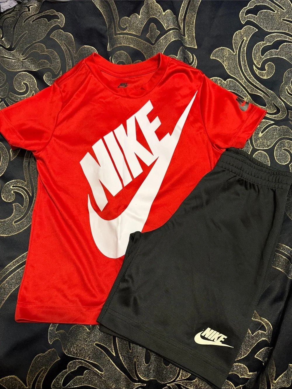 Nike Red Tee with White Logo and Black Athletic Shorts